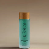 Close-up of KI'OLAL Toner bottle with bamboo cap, highlighting hydration