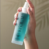 Close-up of KI'OLAL Mist bottle in use, emphasizing skincare ritual