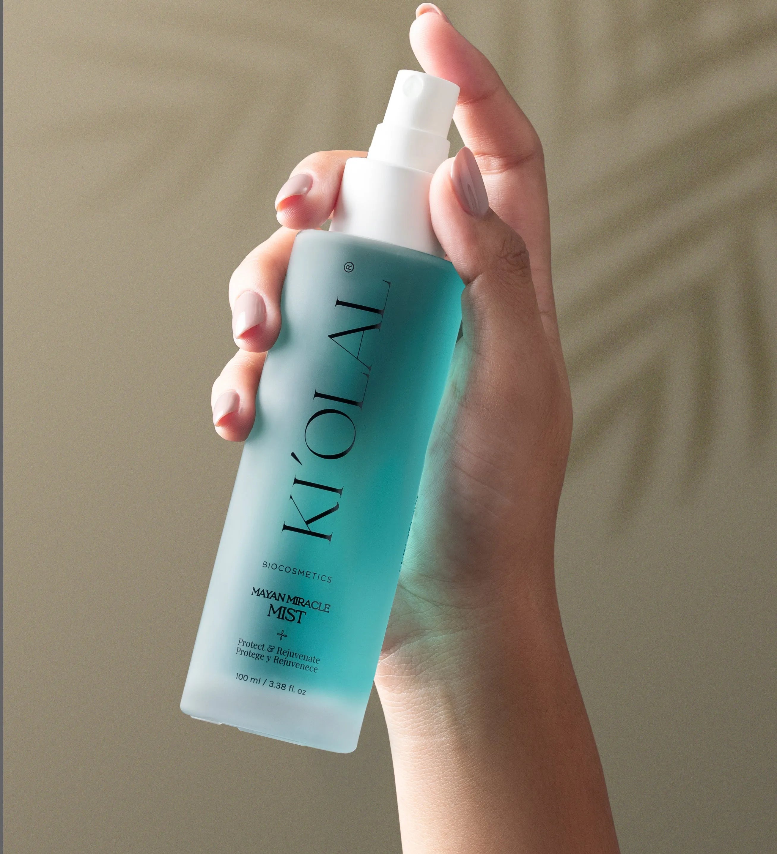 Close-up of KI'OLAL Mist bottle in use, emphasizing skincare ritual