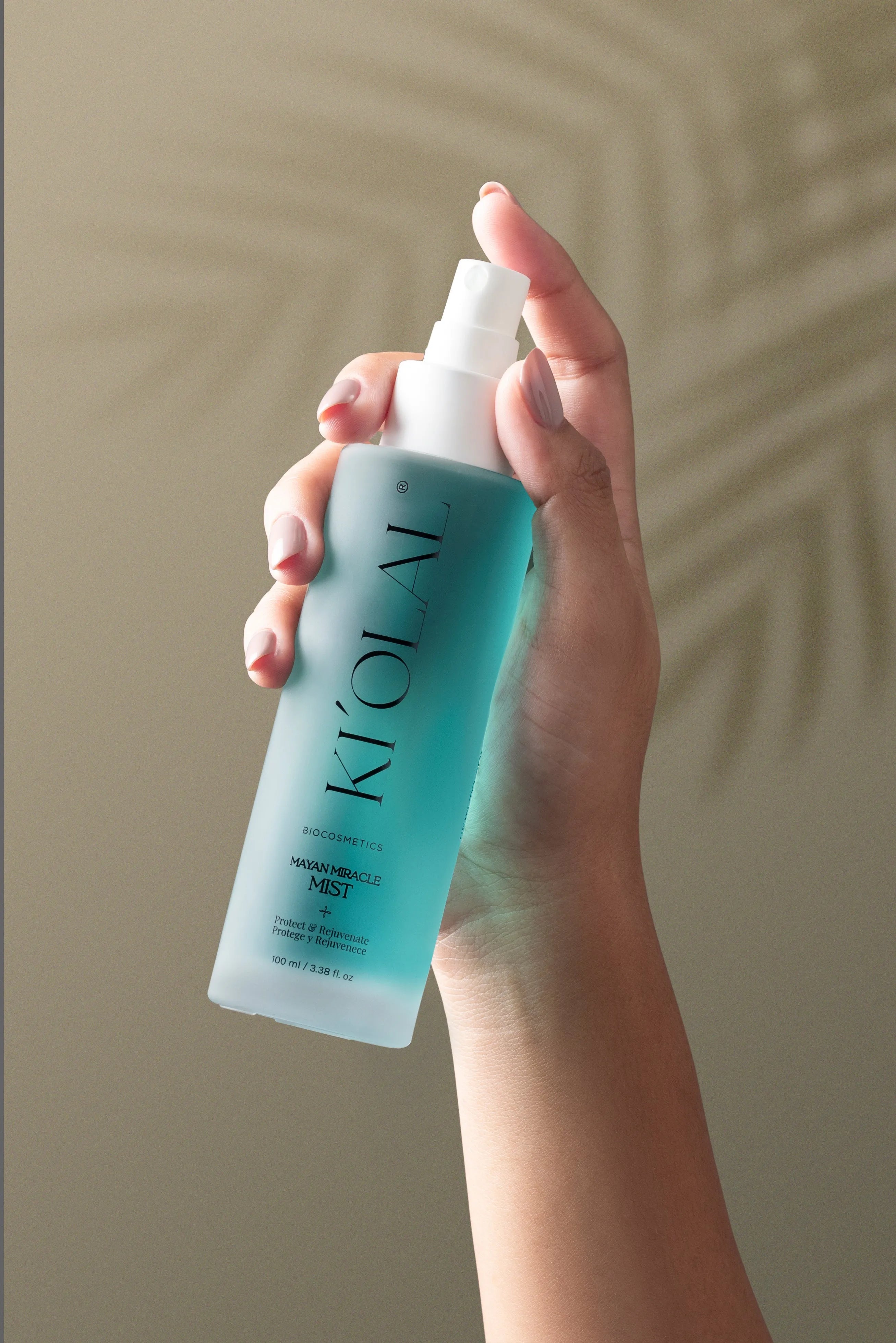 Close-up of KI'OLAL Mist bottle in use, emphasizing skincare ritual
