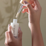 KI'OLAL skincare flat lay in morning light, emphasizing natural beauty