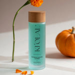 KI'OLAL Toner with marigold petals and pumpkin on minimalist surface
