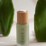 Close-up of KI'OLAL Day Serum with wooden cap and cactus paddles