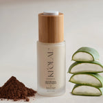Recovery Night Treatment bottle from KI'OLAL, styled with aloe slices and cacao to reflect natural formulation.