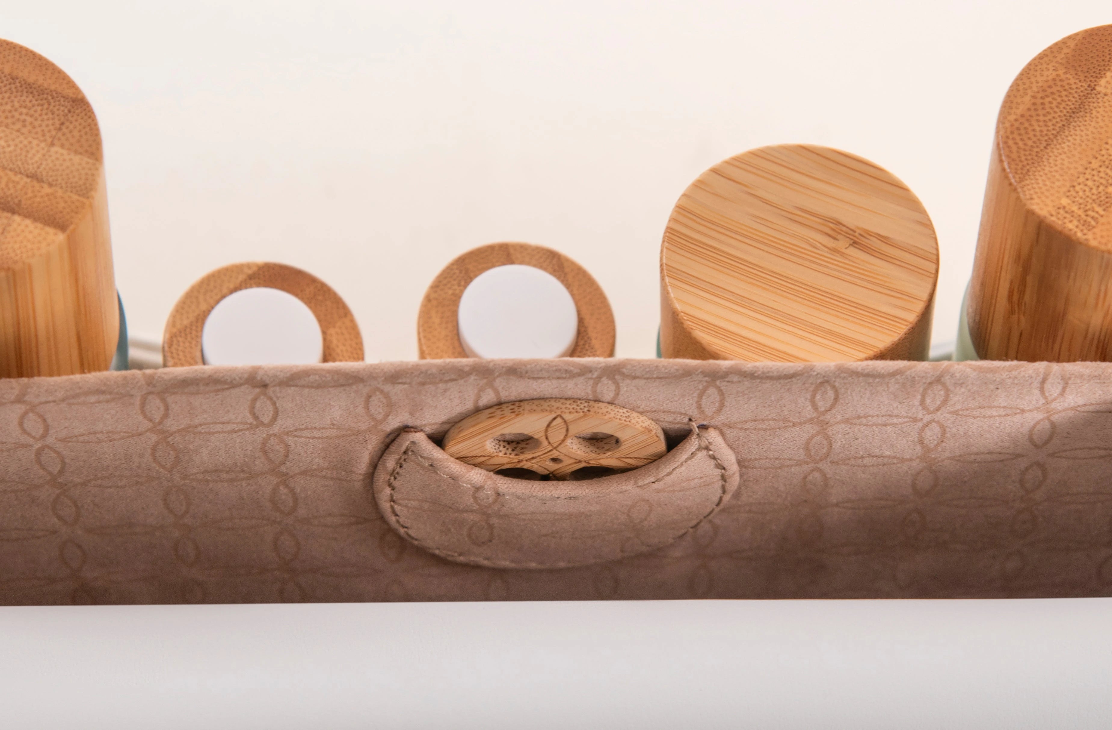 Top view of KI'OLAL skincare set in beige cactus leather case
