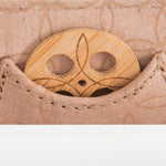 Close-up of KI'OLAL bamboo incense holder in stitched pocket