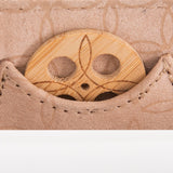 Close-up of KI'OLAL bamboo incense holder in stitched pocket