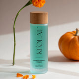 KI'OLAL Toner with marigold petals and pumpkin on minimalist surface