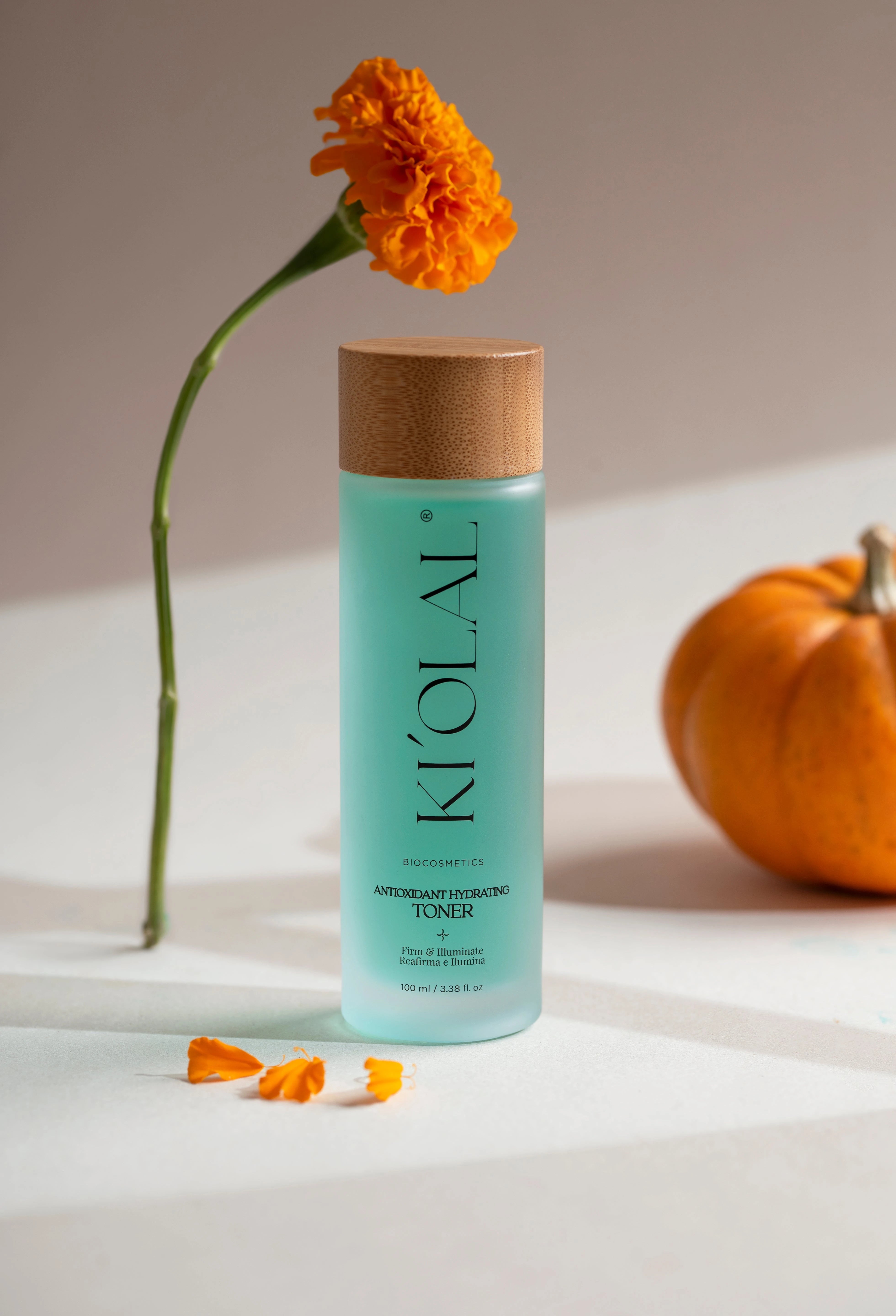 KI'OLAL Toner with marigold petals and pumpkin on minimalist surface